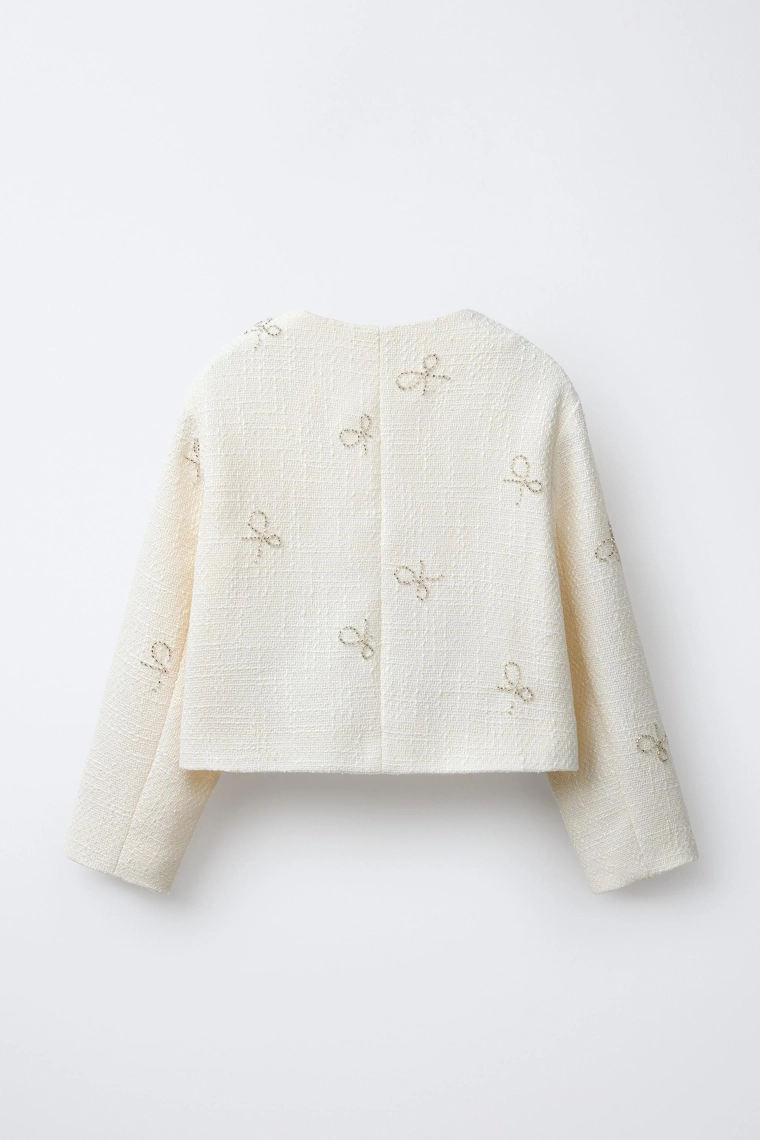 СТРУКТУРНЫЙ ЖАКЕТ С БАНТАМИ И БЛЕСТКАМИ