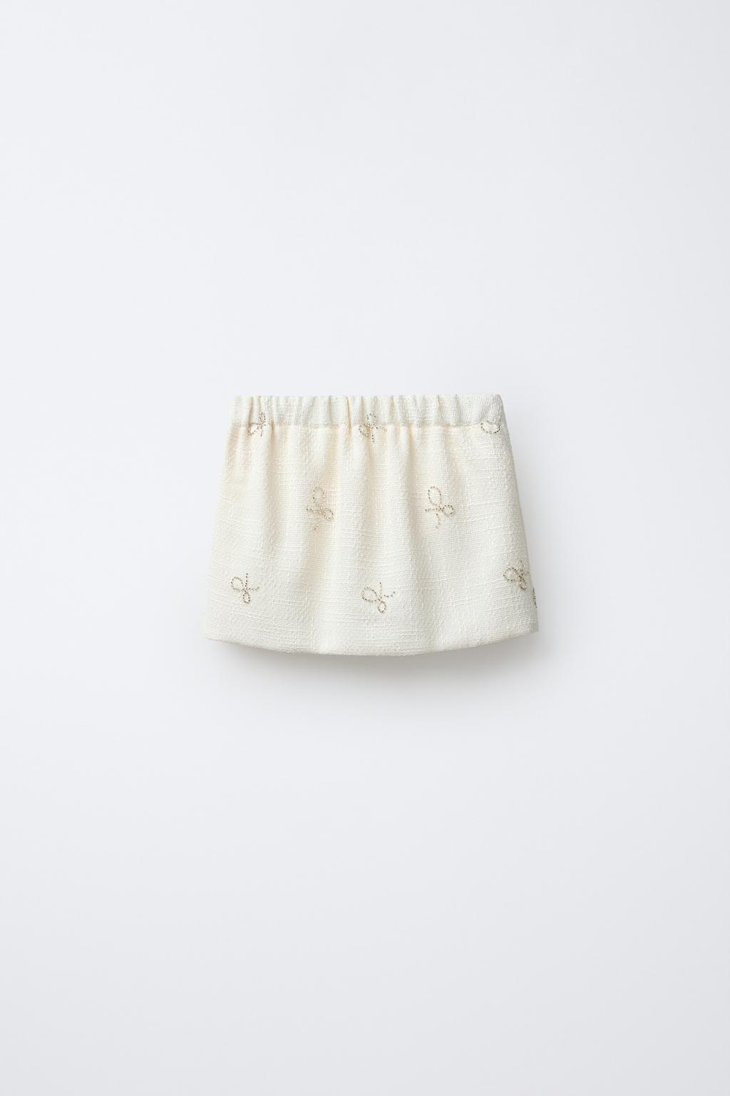 СТРУКТУРНАЯ ЮБКА С БАНТАМИ И БЛЕСКОМ