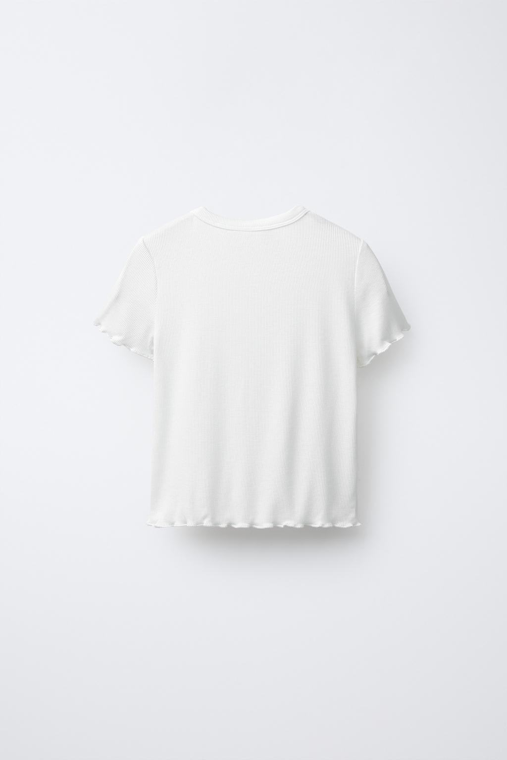 Футболка с пайетками и листьями