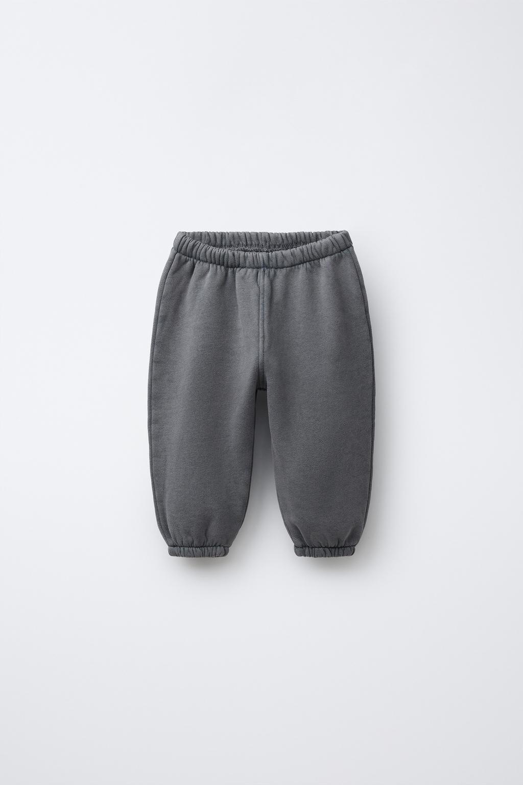 ДЖОГГЕРЫ С ЭФФЕКТОМ ПОТЕРТОСТИ И НАШИВКОЙ