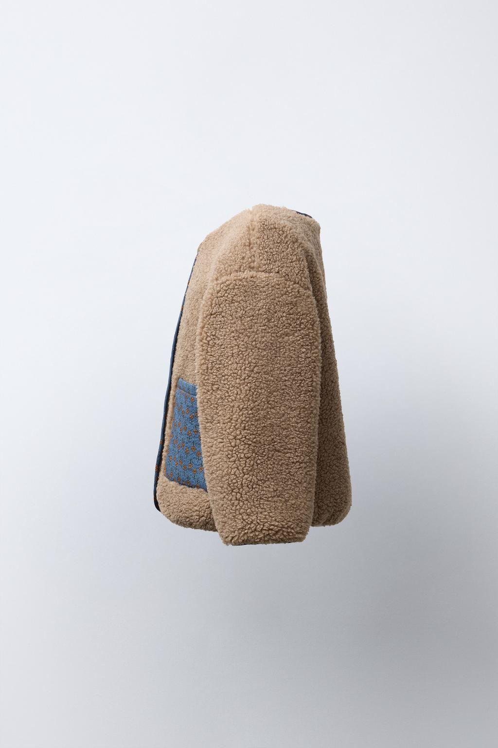 КУРТКА ИЗ ИСКУССТВЕННОЙ ОВЧИНЫ С ЦВЕТОЧНЫМ ПЭЧВОРКОМ