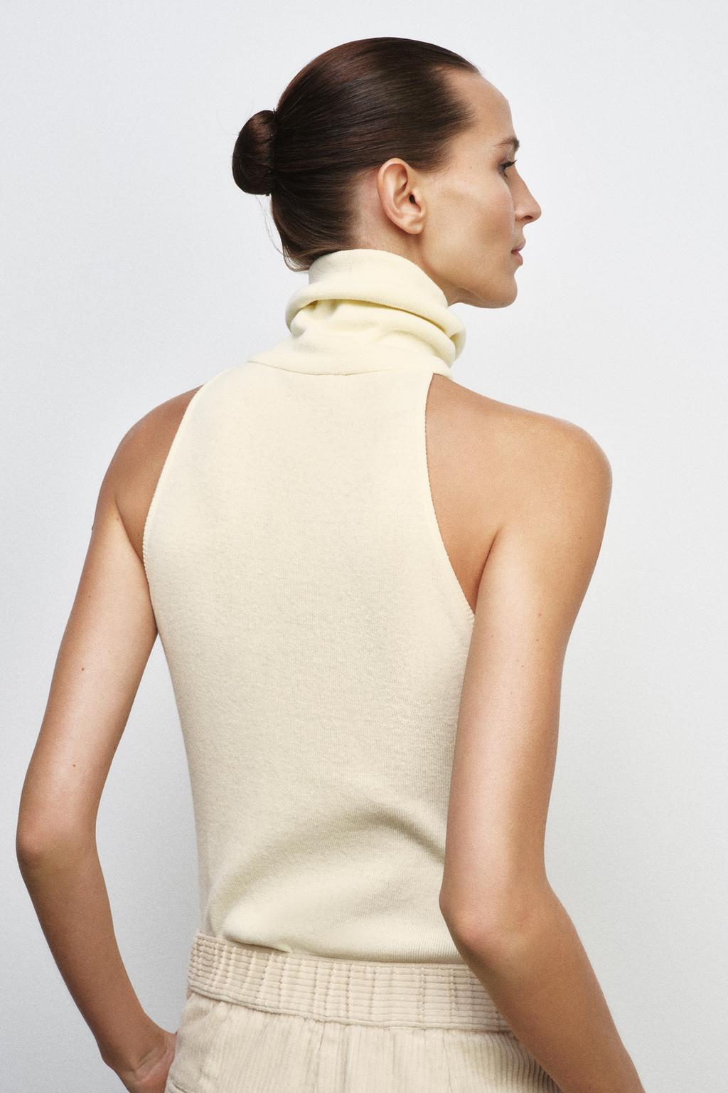 ТОП С ВЫСОКИМ ВОРОТНИКОМ БЕЗ РУКАВОВ