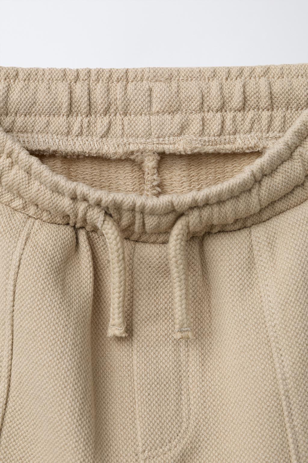 БРЮКИ-ДЖОГГЕРЫ С ЭТИКЕТКОЙ