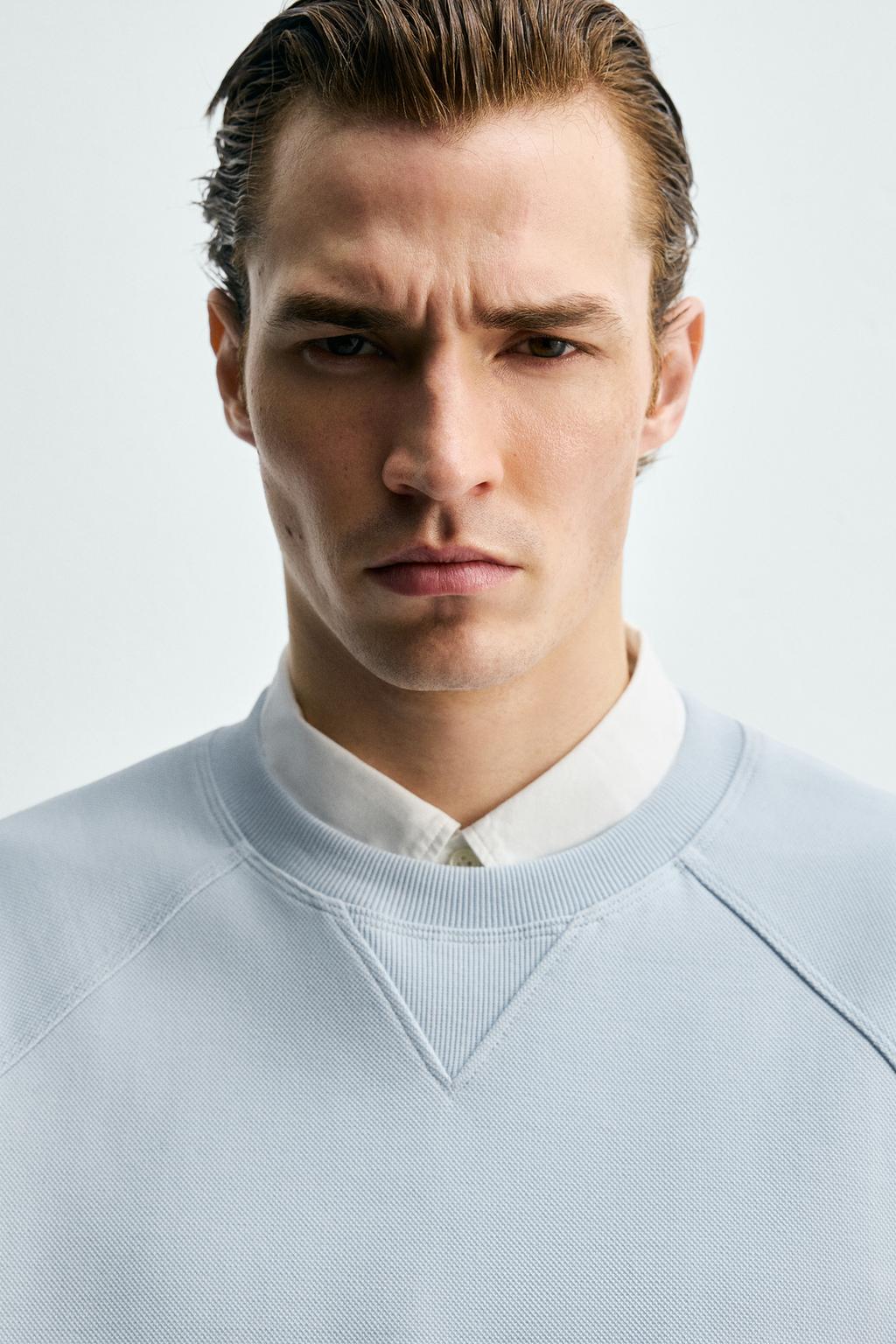 ТОЛСТОВКА ИЗ ТКАНИ ПИКЕ С ЭФФЕКТОМ ПОТЕРТОСТИ