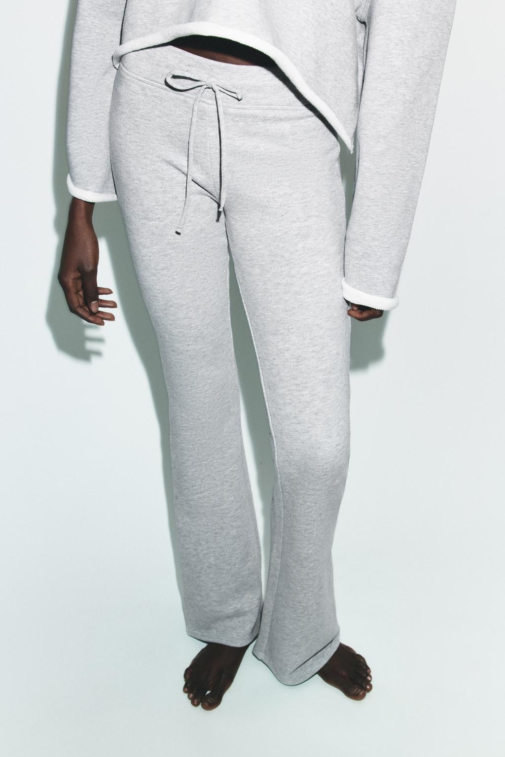 РАСКЛЕШЕННЫЕ БРЮКИ С ЭФФЕКТОМ ПОТЕРТОСТИ