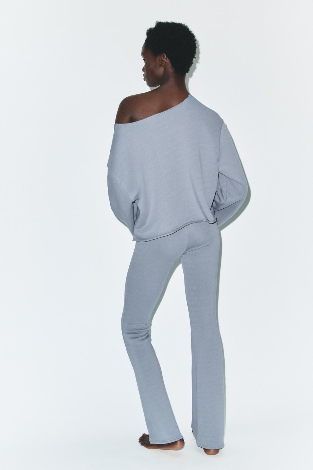 РАСКЛЕШЕННЫЕ БРЮКИ С ЭФФЕКТОМ ПОТЕРТОСТИ