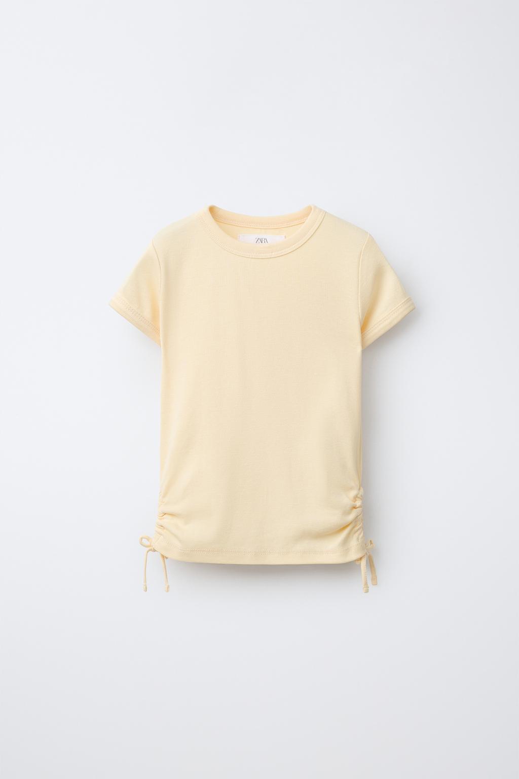 ФУТБОЛКА ИЗ МОДАЛА С ВЫРЕЗАМИ И БАНТАМИ