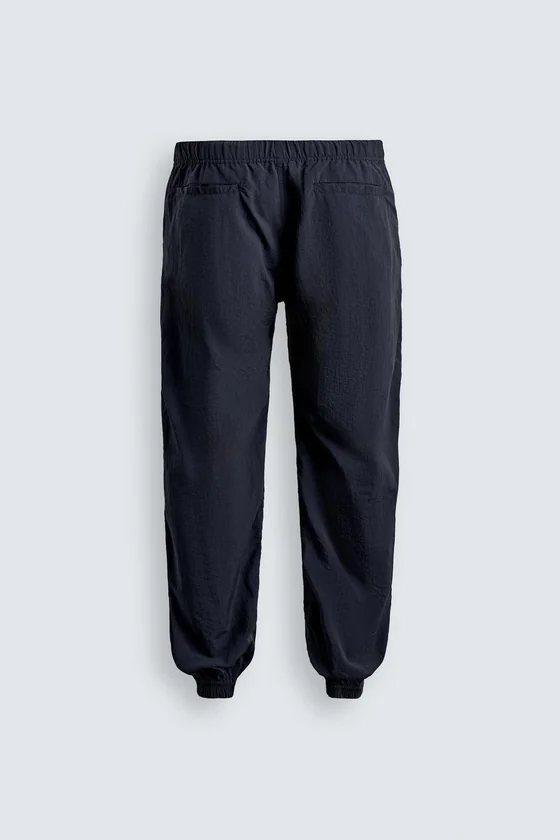 БРЮКИ RELAXED FIT ИЗ ВЫСОКОТЕХНОЛОГИЧНОЙ ТКАНИ LIMITED EDITION