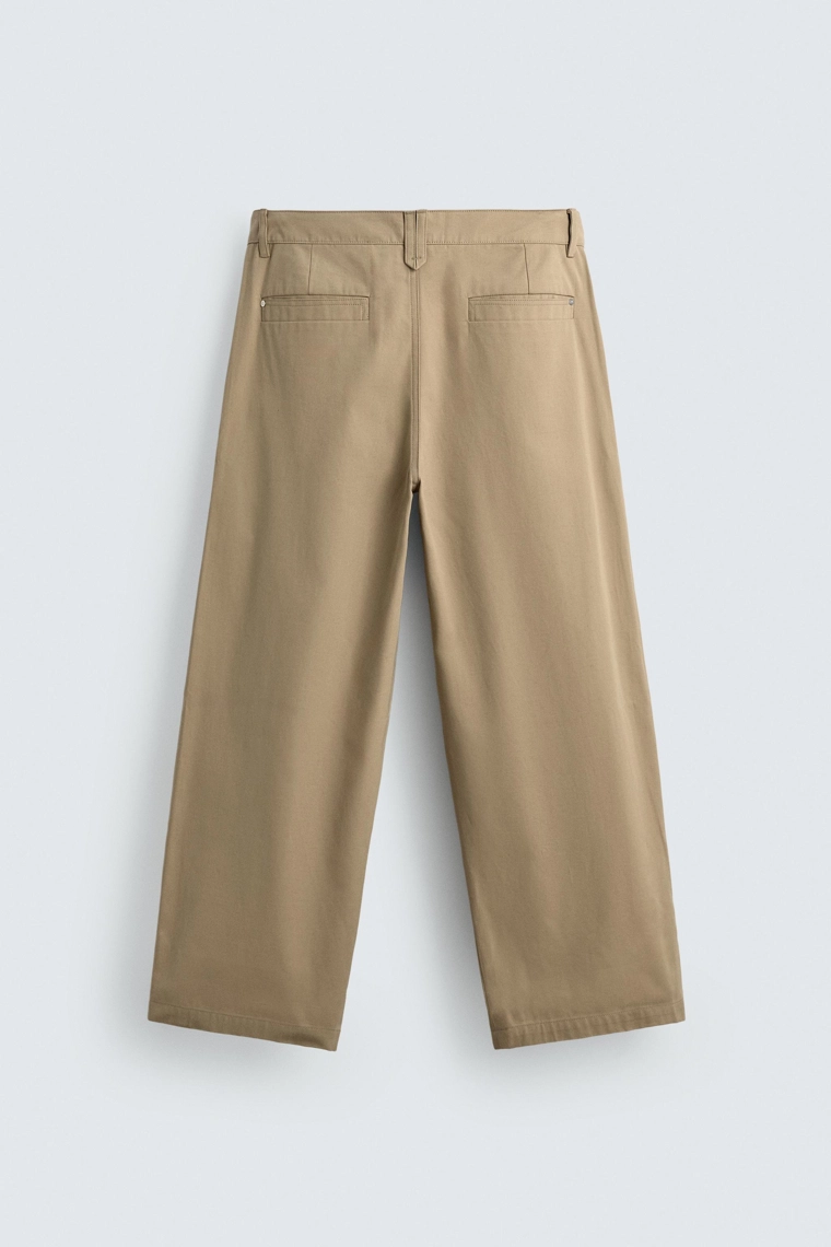 Широкие брюки с защипами