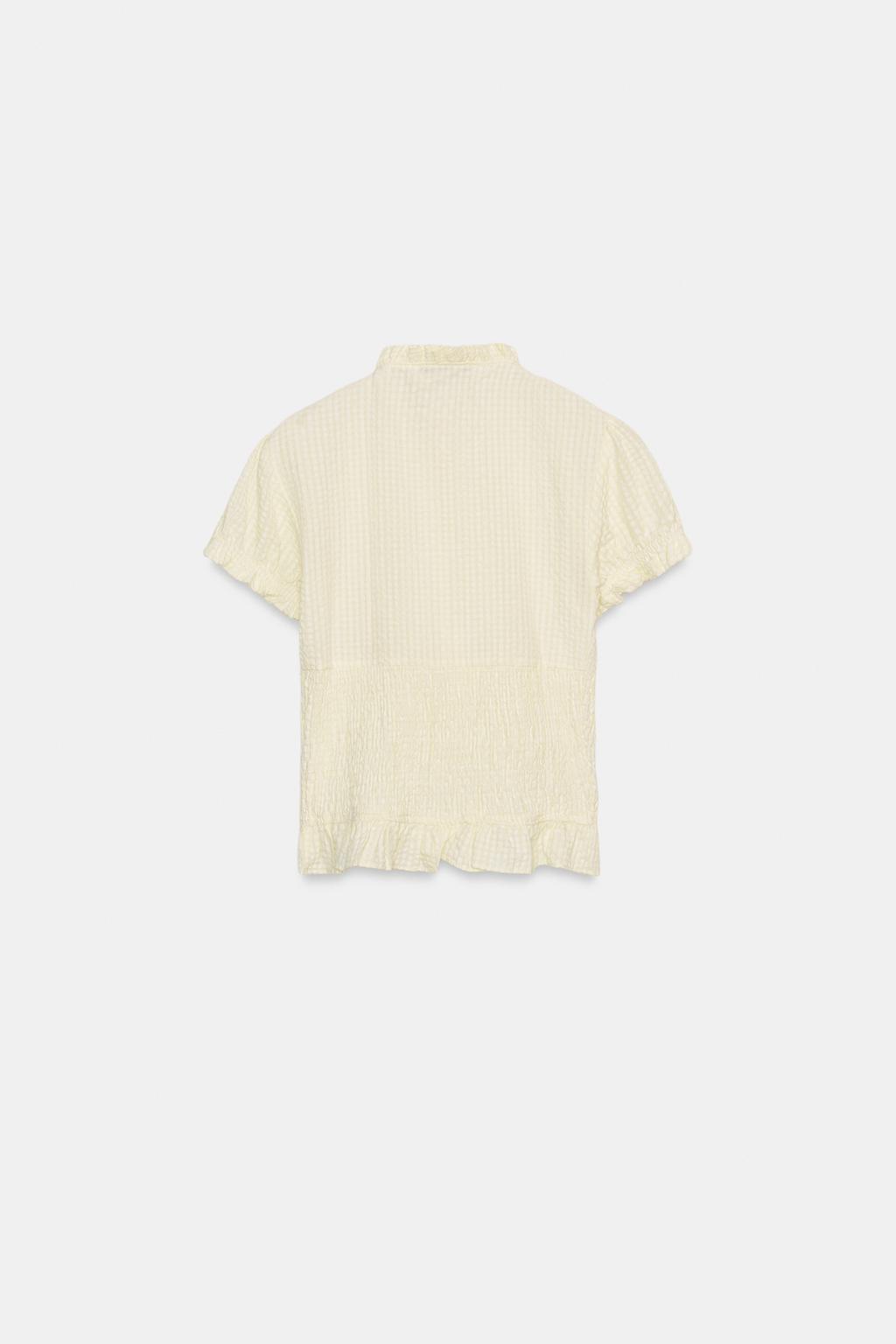 ТОП ИЗ РЕЛЬЕФНОЙ ТКАНИ С БАНТОМ