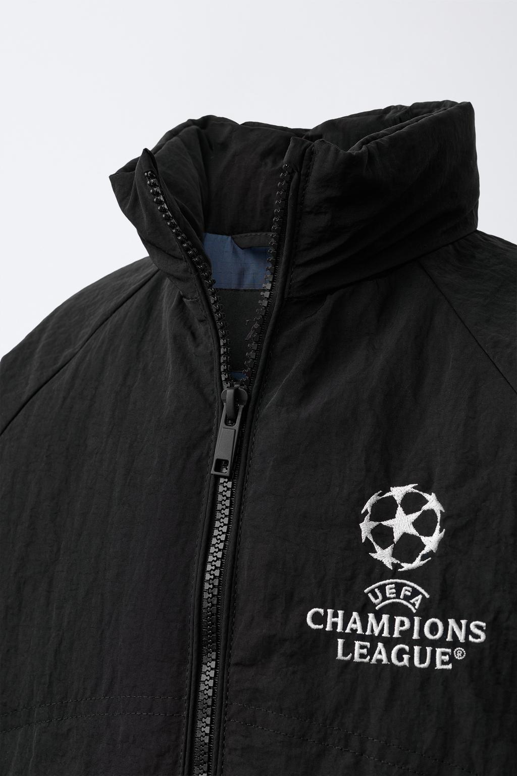 КУРТКА С ПОТАЙНЫМ КАПЮШОНОМ WATER REPELLENT UEFA CHAMPIONS LEAGUE ®