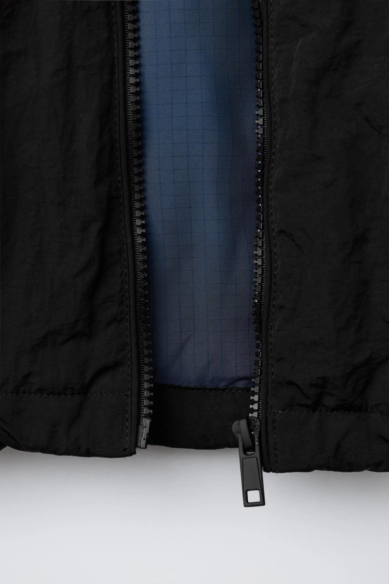 КУРТКА С ПОТАЙНЫМ КАПЮШОНОМ WATER REPELLENT UEFA CHAMPIONS LEAGUE ®