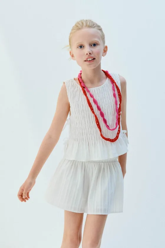 ТОП С ЭЛАСТИЧНОЙ ДЕТАЛЬЮ И БАНТАМИ