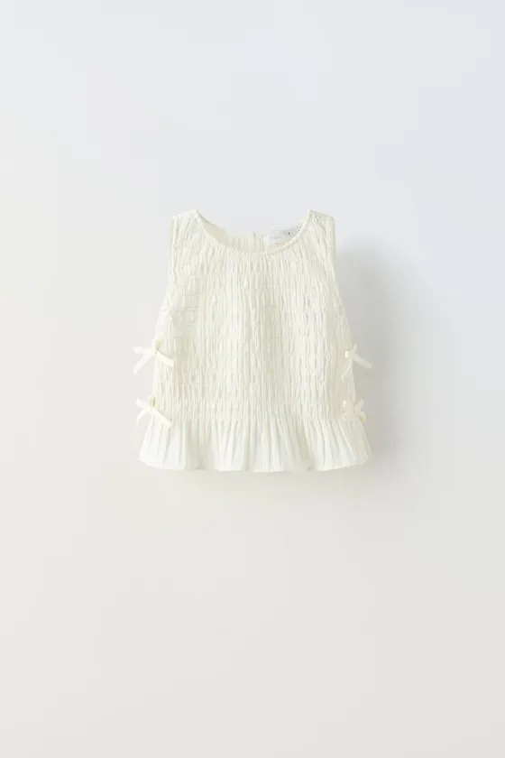 ТОП С ЭЛАСТИЧНОЙ ДЕТАЛЬЮ И БАНТАМИ